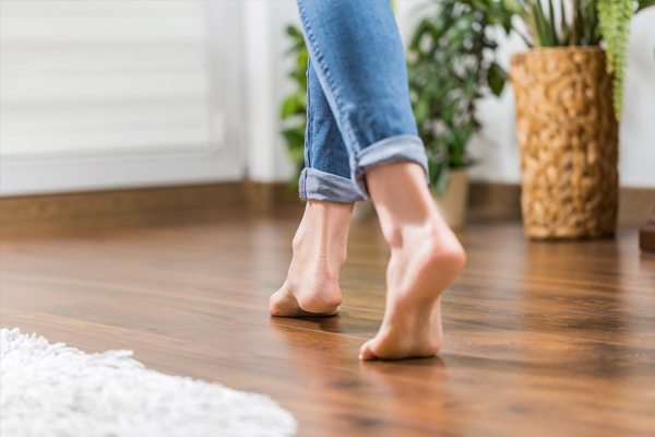 woman walking bare foot on a heated floor