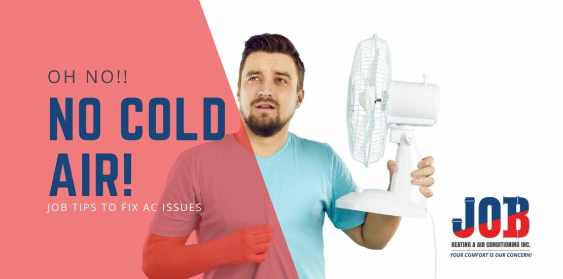 Man at home holding fan to cool down as AC is broken